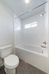 Fototapeta na wymiar White bathroom interior with windows and gray tiles flooring