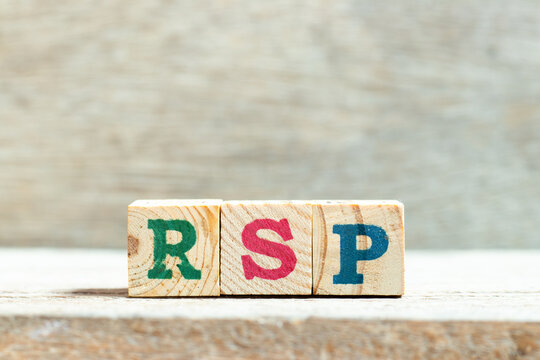 Alphabet letter block in word RSP (Abbreviation of Retail  selling price, Retirement savings plan or Research and sponsored programs) on wood background