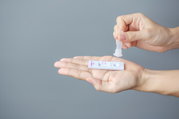 man swab COVID-19 testing by Rapid Antigen Test kit. Coronavirus Self nasal or Home test, Lockdown and Home Isolation concept