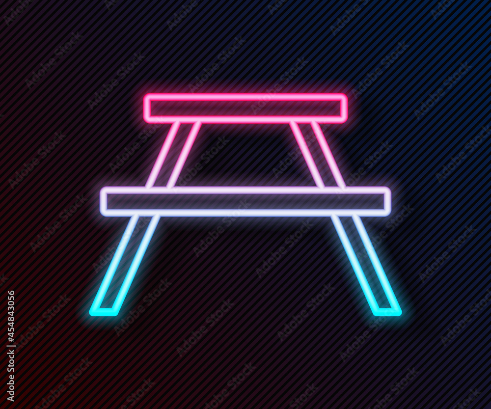 Poster glowing neon line picnic table with benches on either side of the table icon isolated on black backg