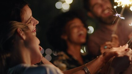 new years celebration friends with sparklers sharing holiday celebration together having fun party evening in home backyard at night 4k