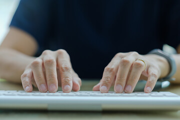 closeup hand typing keyboard, working with laptop, business man, use computer for working
