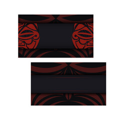 Preparing a business card with a place for your text and a face in a polizenian style ornamentation. Black business card design with mask of the gods patterns.