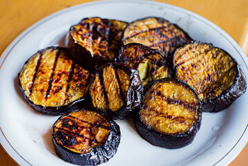 grilled aubergine on the white plate