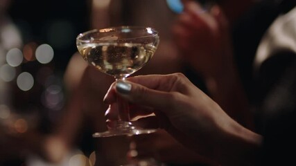 close up group of friends making toast celebrating at glamorous rooftop party event drinking champagne at formal social gathering enjoying evening celebration at night 4k