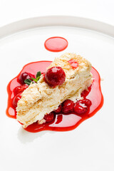 napoleon cake with cherry sauce and mint