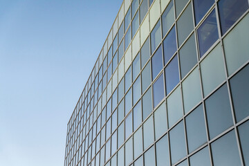 Fototapeta na wymiar Facade of a glass building against the clear blue sky background at Tacoma, Washington