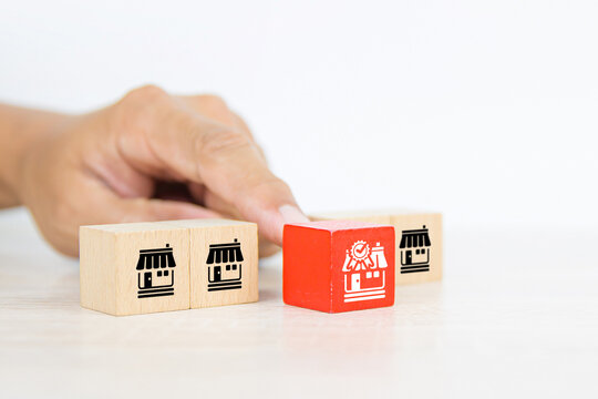 Franchise, Close-up hand choose cube wooden toy block stack with standard and best quality for franchises business store icon for business growth and branch expansion and bank loan.