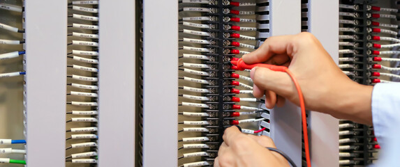 Electricity and electrical maintenance service, Engineer using measuring equipment checking...