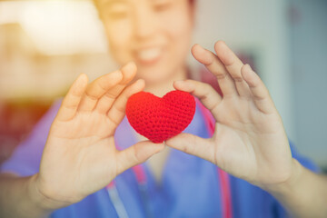 nurse sharing love red heart for health care giving medical help and donation together concept