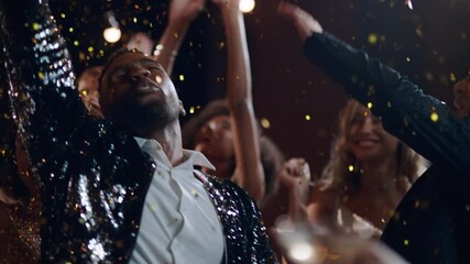 friends celebrating new years eve party dancing throwing confetti enjoying glamorous celebration countdown wearing stylish fashion at formal social gathering on rooftop at night 4k 