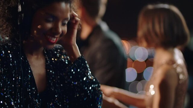 beautiful dj woman playing music at glamorous rooftop party celebration dance enjoying fancy social event wearing stylish fashion dancing performing live in club at night 4k footage