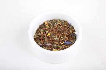 tea leaves for brewing in a white cup