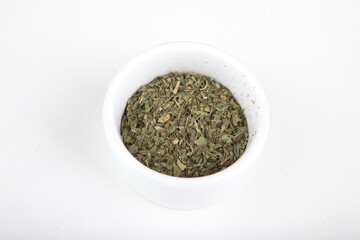 tea leaves for brewing in a white cup