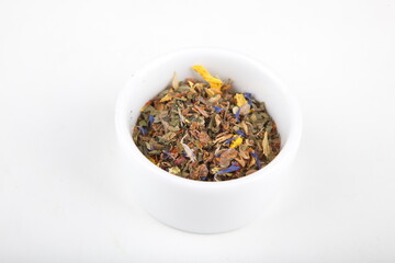 tea leaves for brewing in a white cup
