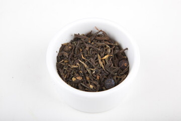 tea leaves for brewing in a white cup