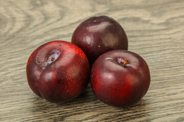 Ripe sweet plum fruit heap