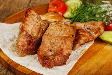 Grilled pork shashlick served vegetables