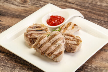 Grilled pork tenderlion with tomato sauce