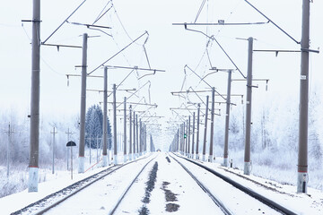 winter railway landscape, view of the rails and wires of the railway, winter delivery way
