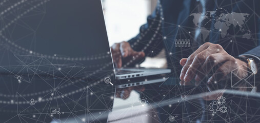 Businessman using laptop computer and digital tablet with global structure networking and data exchanges customer connection