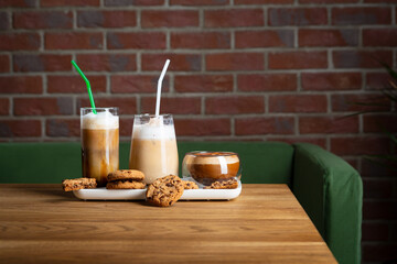 Coffee beverages on table in cafe copy space