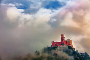 Fototapeta premium Pena National Palace, Sintra, Portugal, Partly Covered in Afternoon Fog after Rain