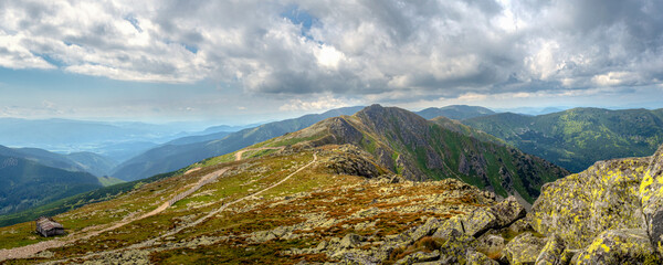 view of a mountain top shooted from Chopok, famous Low Tatra mountain with its beautiful scenery of summer surroundings © jan_S