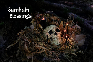 Samhain Blessings. human skull, candles, dry leaves on dark background. magic esoteric ritual....