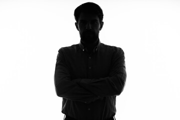 The man in a suit gun in the hands of the emotions silhouette isolated background