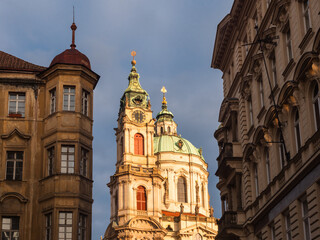 Fototapeta na wymiar Baroque Dome and Spire of Saint Nicholas Church in the Lesser Town of Prague, Czech Republic in the Morning