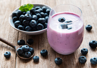 Glass of blueberry yogurt with blueberries