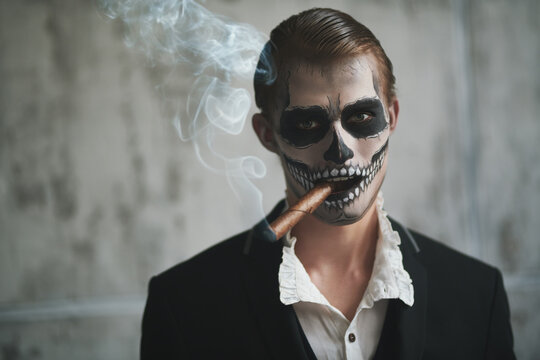 skeleton smokes a cigar