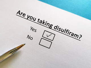 One person is answering question about alcohol abstinence. The person is taking disulfiram