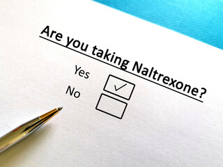 One person is answering question about alcohol abstinence. The person is taking naltrexone