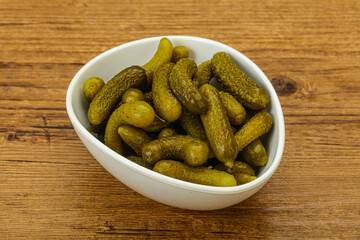 Pickled gherkin in the bowl