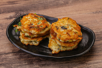 Zucchini pancakes with herbs and spices