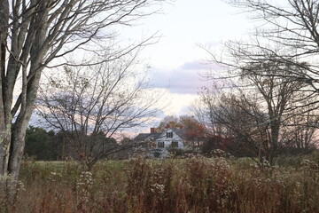 sunset over abandoned house