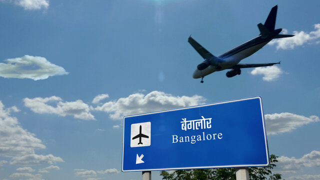 Plane landing in Bangalore India airport with signboard