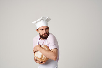 male chef with bread in his hands cooking baking