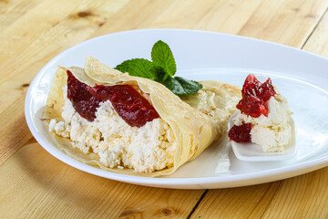 Pancake with cottage cheese and jam