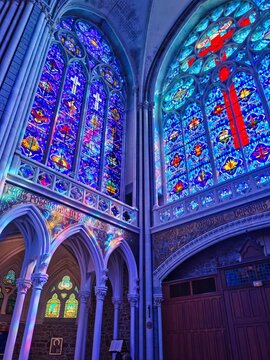 Beautiful stained glass windows, interior of the basilica of Pontmain, northern France.