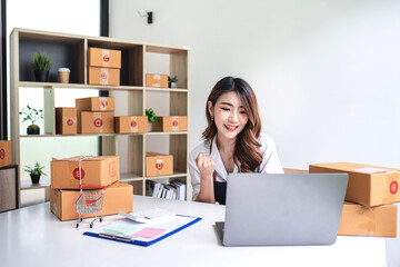 businesswoman start small business and successful SME entrepreneurs A woman works from home delivering parcels online. SME delivery concept and packaging