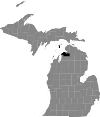 Black highlighted location map of the Charlevoix County inside gray map of the Federal State of Michigan, USA