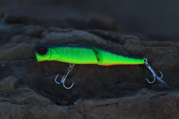 Fishing lure walker on stone background