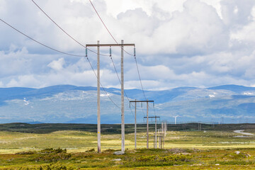 Power line in a wild mountain moor landscape