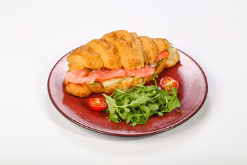 Croissant with salmon for breakfast