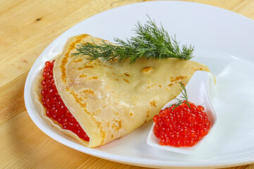 Russian pancake with red caviar