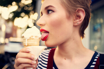 short haired woman outdoors eating ice cream walk lifestyle