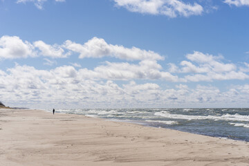 Coast of the Baltic Sea. Sand dunes with clouds. Typical Baltic beach landscape.